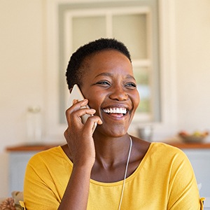 Woman smiling while talking on phone