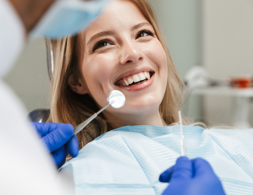 Woman smiling at dentist in chair